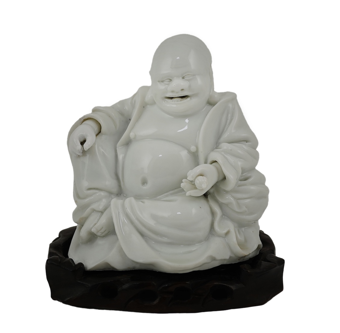 A Chinese blanc-de-chine seated figure of Budai, 18th/19th century